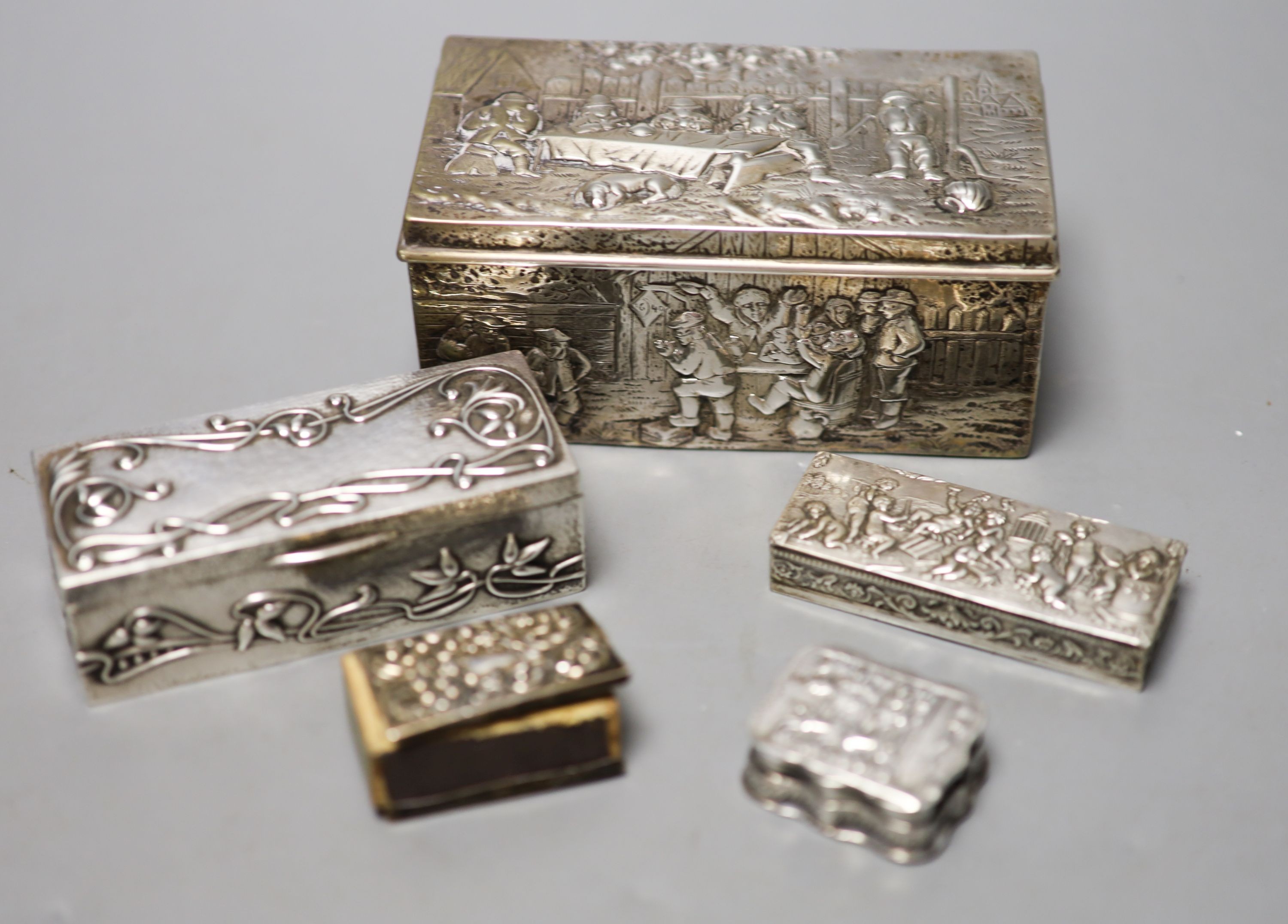 A late 19th century German embossed 800 standard white metal rectangular box, 12.2cm, three smaller boxes, including two silver and a match sleeve.